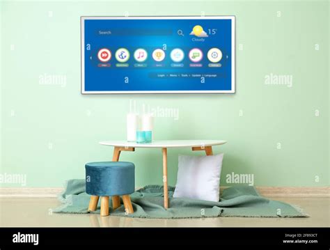 Modern Tv Set Hanging On Mint Wall In Living Room Stock Photo Alamy