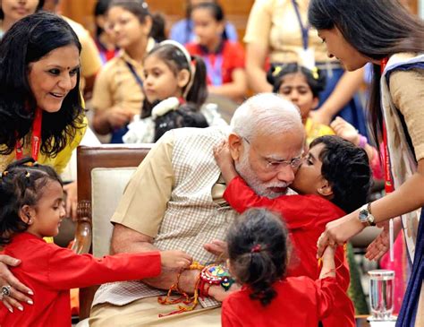 A Girl Ties Rakhi To Prime Minister Narendra Modi