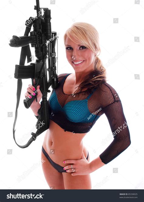 Sexy Blonde Girl Holding An Assault Rifle Stock Photo