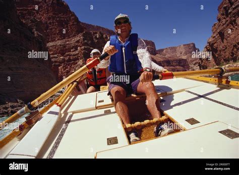 Rafting People In A Rowing Boat On Colorado River Grand Canyon