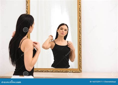 Beautiful Young Woman Looking At Herself In Mirror Stock Image Image