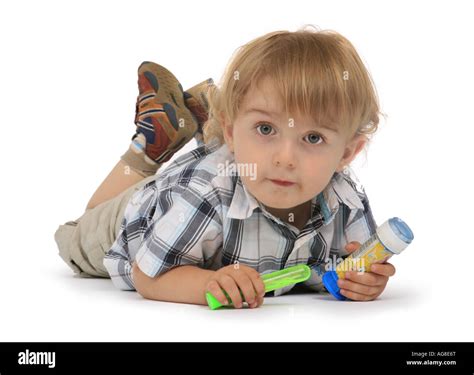 Small Boy Lying On The Floor Stock Photo Alamy