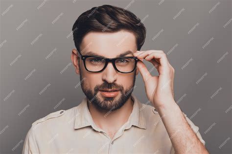 Premium Photo Portrait Of Smart Handsome Bearded Man Touching His Glasses