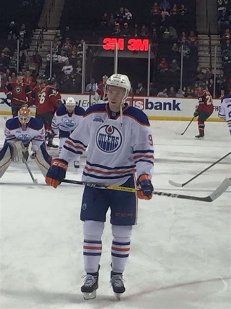 An Ice Hockey Player Is Standing On The Ice