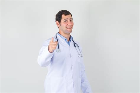 Free Photo Male Doctor In White Coat Pointing Finger To Camera And