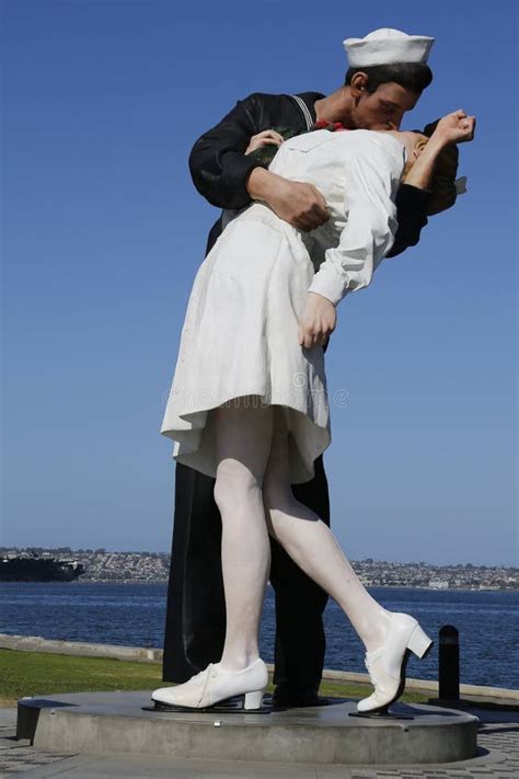 The Unconditional Surrender Sculpture By Seward Johnson In The Front Of Uss Midway In San Diego