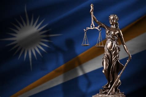 Premium Photo Marshall Islands Flag With Statue Of Lady Justice And