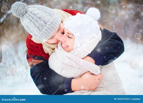 Young Couple Hugging on Snow in Winter Park Stock Image - Image of female, happiness: 101012733