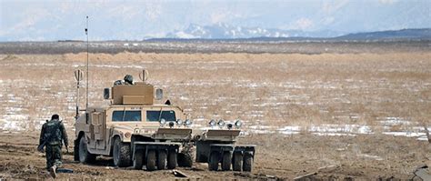 An Afghan National Army Route Clearance Company Patrols Alongside