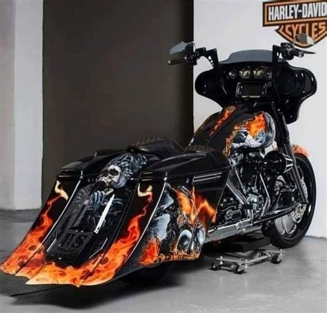 A Custom Motorcycle With Flames Painted On It