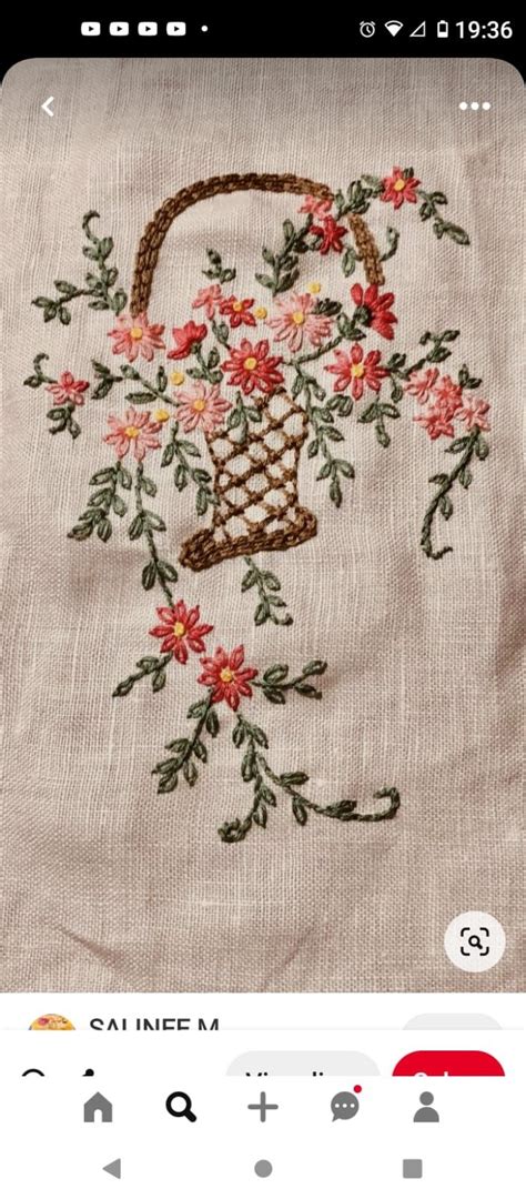 An Embroidered Bag With Flowers On It Is Displayed In The Appliqued Screen