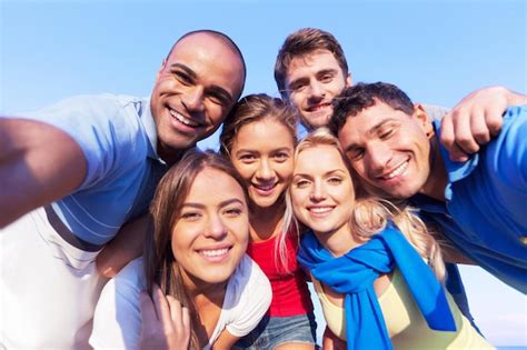 Premium Photo Multiracial Group Of Friends Taking Selfie At Beach