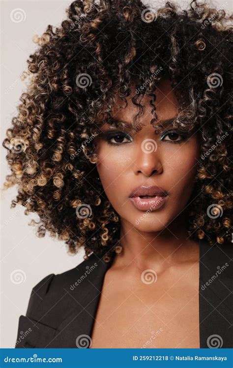 Close Up Of African American Woman With Afro Hair Posing Indoor