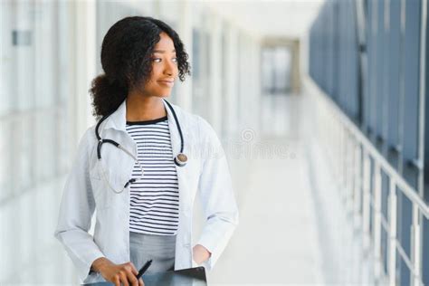 Beautiful African American Female Pediatric Nurse In Modern Office