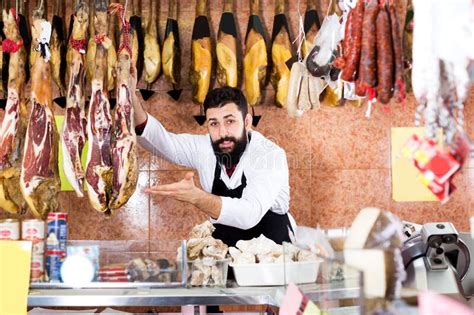 Male Shop Assistant Demonstrating Jamon Stock Image Image Of