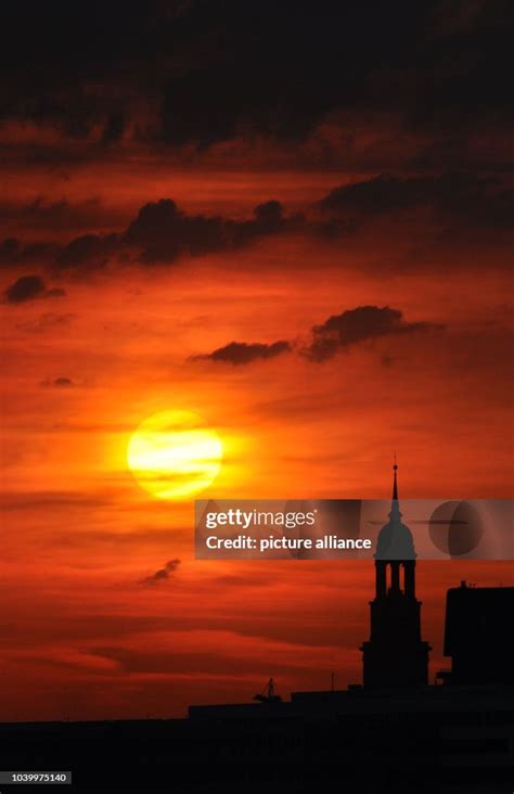 The Sun Sets In Hamburg Germany 6 August 2015 On The Right The