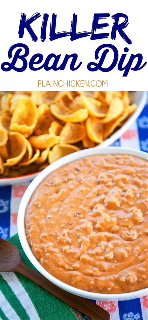 A White Bowl Filled With Baked Beans And Tortilla Chips On Top Of A