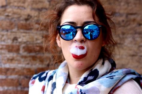 Premium Photo Close Up Of Woman Wearing Sunglasses Smoking Against