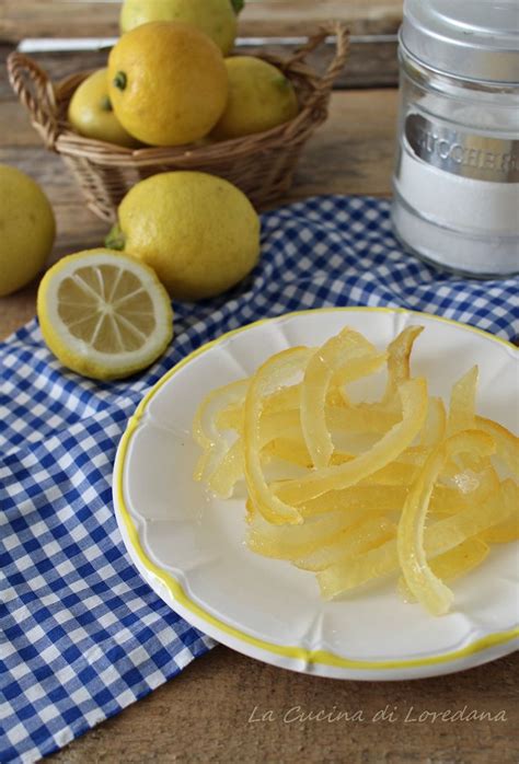 Sliced Lemons On A White Plate Next To Some Lemons