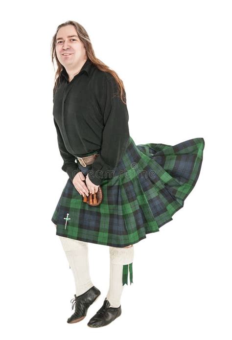 Homem Escocês No Traje Nacional Tradicional Kilt De Sopro Imagem de