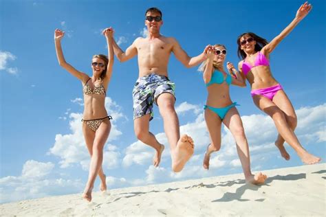 Happy people on beach — Stock Photo © yanlev #73727631