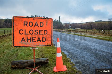 Road closed sign due to flooding by Kathryn Taylor - Truestock