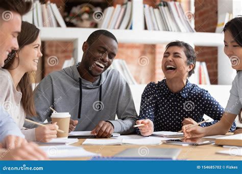 Smiling Multiracial Young People Have Fun Studying Together Stock Photo