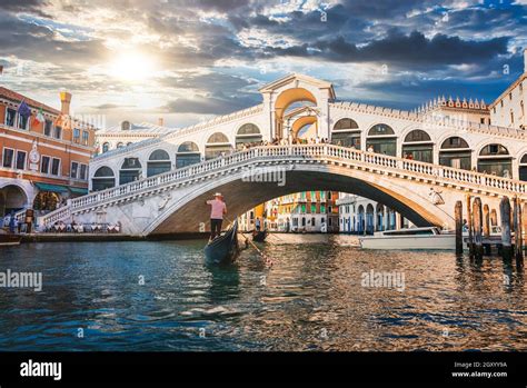 Traditional Gondola Near World Famous Canal Grande And Rialto Bridge