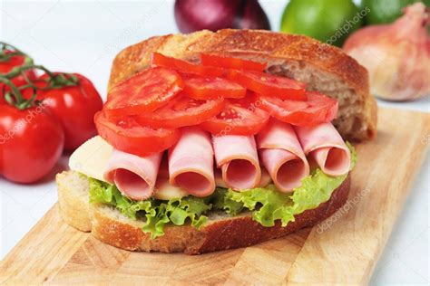 Baloney sandwich with lettuce and tomato — Stock Photo © igordutina #130123742