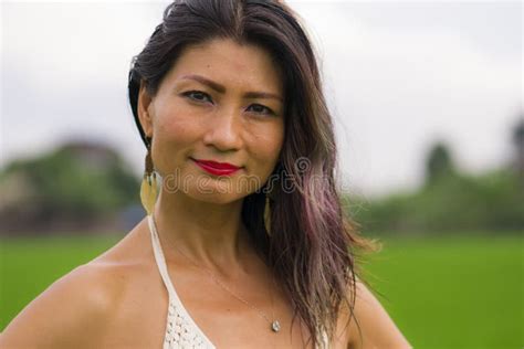 Outdoors Holidays Portrait Of Attractive And Happy Middle Aged Asian