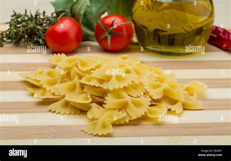 Raw Farfalle Italian Pasta On The Wood Board Stock Photo Alamy