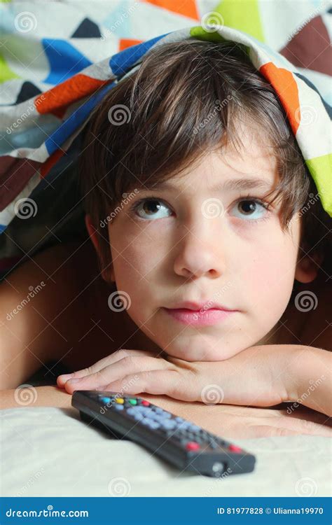 Boy Watch Tv with Remote Control Stock Photo - Image of control, cozy ...