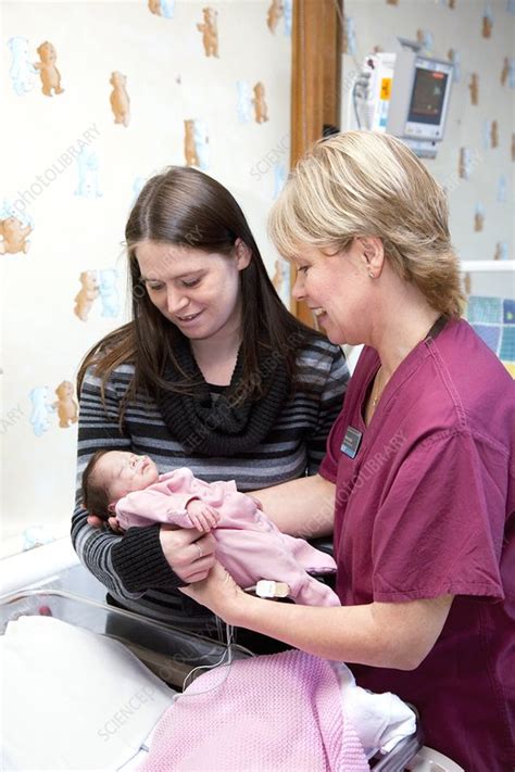 Mother, nurse and newborn baby - Stock Image - C009/1652 - Science Photo Library