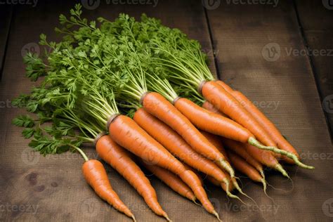 Bunch of fresh carrots with green leaves. Vegetarian food ...