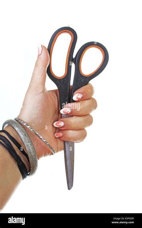 Woman Hand Holding Scissors On Isolated White Cutout Background Studio