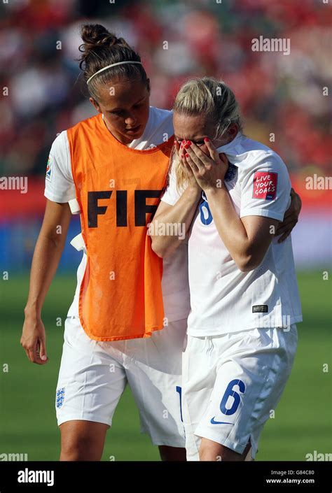 England's Laura Bassett is consoled after scoring an own goal in the 92 ...