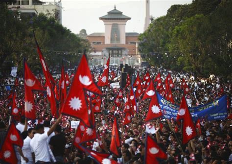 Demonstrators Carrying The National Flag Of Nepal Participate In A