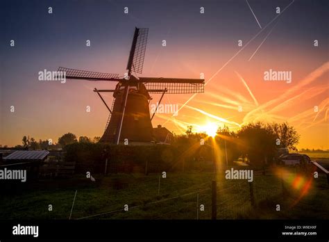 Beautiful sunset in front of windmill, Netherlands Stock Photo - Alamy