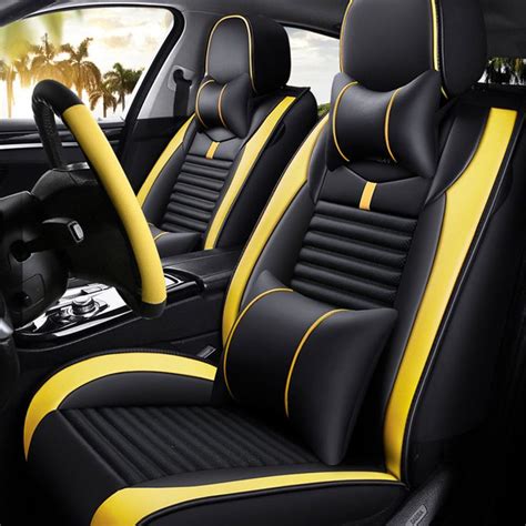 The Interior Of A Car With Black And Yellow Leather Seats