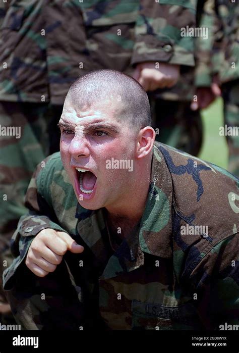 A Us Army Usa Trainee Yells Encouragement To A Platoon Member In A