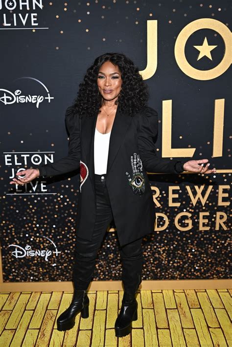 Angela Bassett Suits Up In Platform Boots For Elton Johns Farewell Footwear News