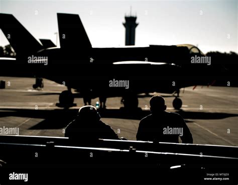 A U S Air Force Weapons Load Crew Assigned To The 33rd Aircraft