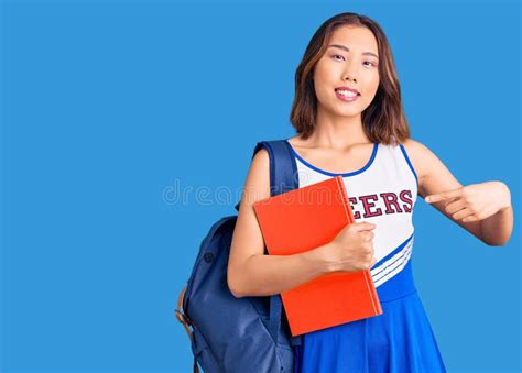 Young Beautiful Chinese Girl Wearing Cheerleader Uniform And Student