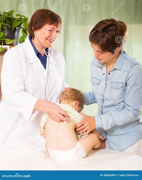 Friendly Pediatrician Doctor Examining Baby Stock Image Image Of