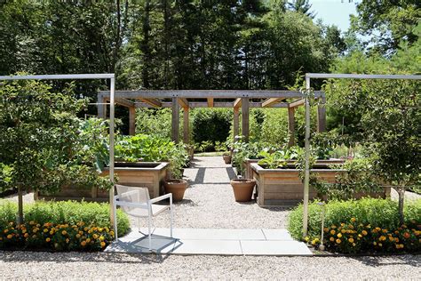 Fruit Trees Edge A Sunny Respite With A Cedar Pergola And Raised Vegetable Beds In This Edible