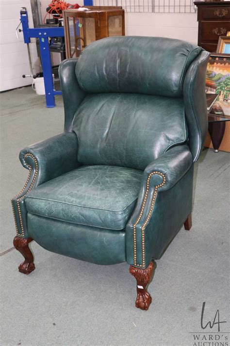 Green Leather Upholstered Chippendale Style Wingback Recliner With Nail Head Decoration And