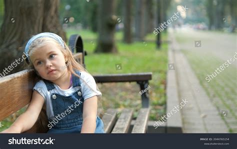 Girl Sitting Alone In Garden