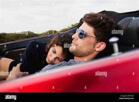 Couple Lying In Car Sleeping Stock Photo Alamy