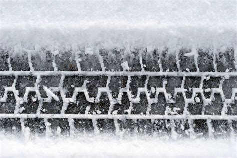 Close-up car tire tracks in the snow | Stock image | Colourbox