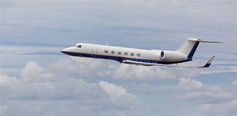 Side View Of A Private Jet Flying Stock Photo Image Of Front Flight